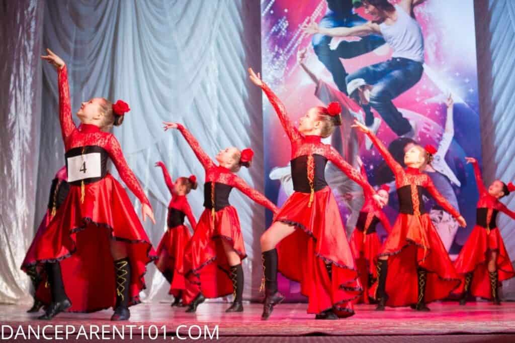 dancers wearing red dress and red scrunchies