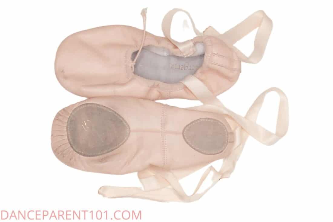 A close-up of a dancer's feet in ballet flats, showcasing the elegance and precision of the shoe.