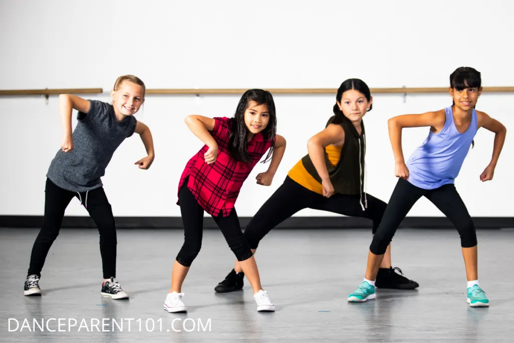 Four girls in a dance studio learning Hip Hop Dance - - What to Expect From Your Child's First Hip Hop Dance Class