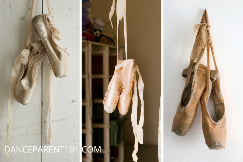 A triptych of pointe shoes hanging from their ribbons