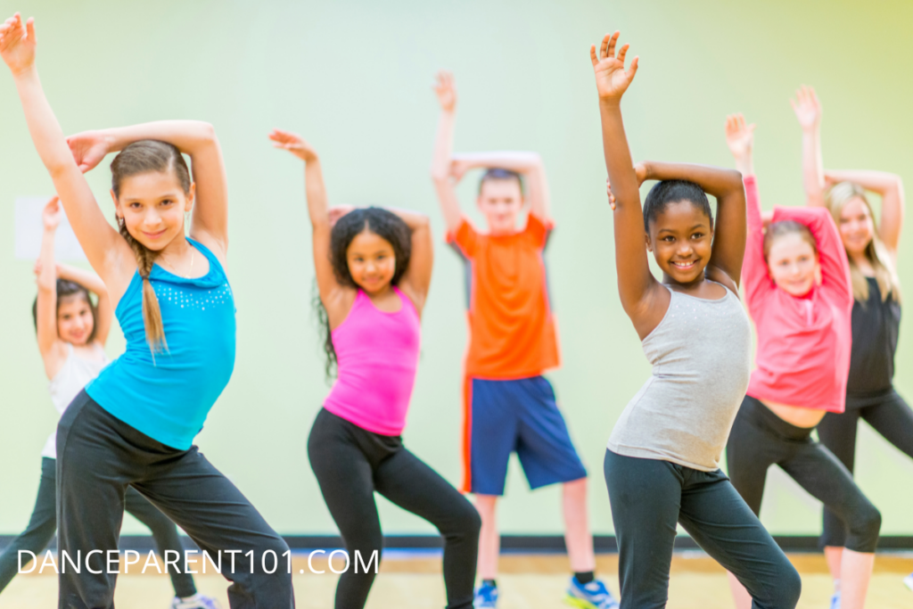 Image of several children hitting a jazz dance pose in dance class